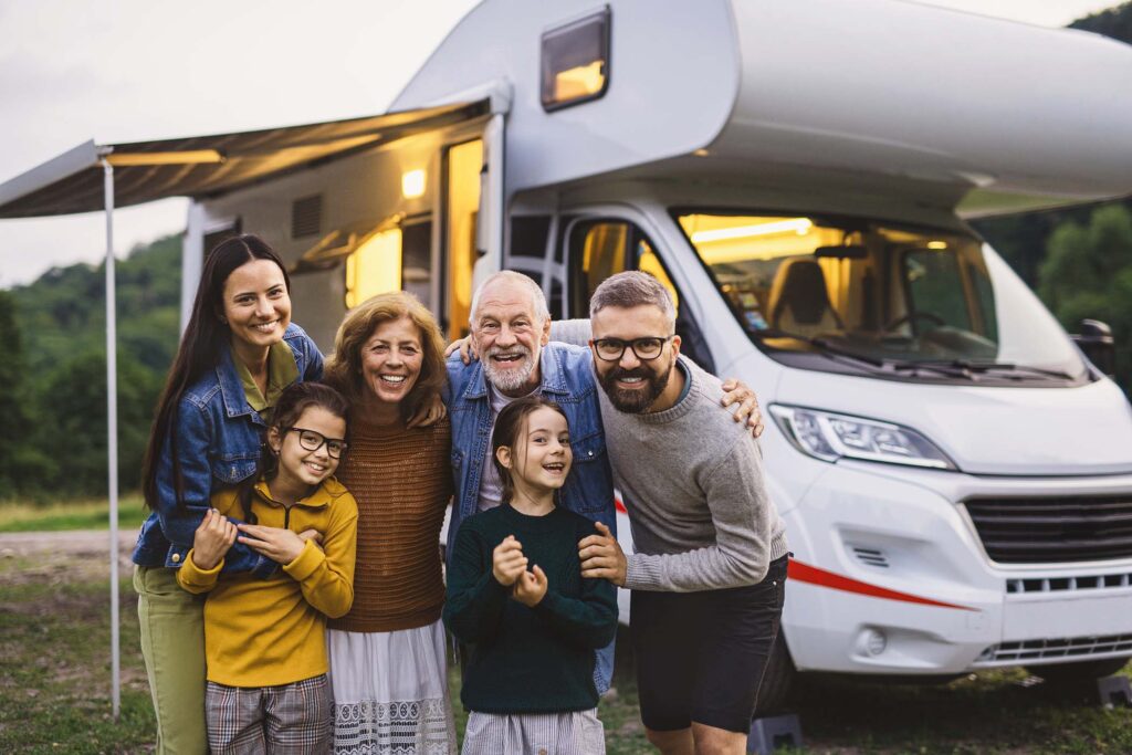 multi-generation-family-looking-at-camera-outdoors-S4UKKLC.jpg